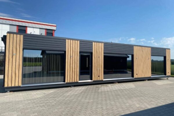 The Full Basics 8 Ft W X 30 Ft L X 9.5 Ft T 240 Sq.Ft. Weight Approx. 10,000 Lb 50 Amp Panel / 220W Plug In Included Modern Fiberglass Front Door Luxury Vinyl Plank Floors Dual Pane Tempered Glass Vinyl Frame Windows And Sliding Door Shiplap Paneling On Ceiling Aluminum Frame Glass Roll Up Garage Door 2”X3” Lumber Framing And Drywall Closed Cell Spray Foam Insulated (3” Walls And Ceiling) Shaker Style Wood Cabinets In Kitchen, Bath, And 2 Bedrooms Smoke Detector And Fire Extinguisher Tankless Propane Water Heater Pioneer Mini Split 9,000 BTU Solar Power / Tech (3) 320W Mono Solar Panels, 3000W Go Power Inverter (4) 500W Full River Solar Batteries, Mounting Rails, Propane 4 Burner Stove Electric Range Exhaust System Summit 7 Cu.Ft. Refrigerator Bathroom Ceramic Subway Tile Shower Moen Faucet And Shower Head Shaker Wood Vanity With Acacia Wood Counter Top, Farmhouse Sit On Top Sink Swiss Madison Dual Flush Toilet (Nature’s Head Composting Toilet
