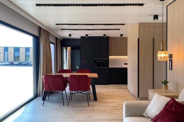 The Full Basics 8 Ft W X 30 Ft L X 9.5 Ft T 240 Sq.Ft. Weight Approx. 10,000 Lb 50 Amp Panel / 220W Plug In Included Modern Fiberglass Front Door Luxury Vinyl Plank Floors Dual Pane Tempered Glass Vinyl Frame Windows And Sliding Door Shiplap Paneling On Ceiling Aluminum Frame Glass Roll Up Garage Door 2”X3” Lumber Framing And Drywall Closed Cell Spray Foam Insulated (3” Walls And Ceiling) Shaker Style Wood Cabinets In Kitchen, Bath, And 2 Bedrooms Smoke Detector And Fire Extinguisher Tankless Propane Water Heater Pioneer Mini Split 9,000 BTU Solar Power / Tech (3) 320W Mono Solar Panels, 3000W Go Power Inverter (4) 500W Full River Solar Batteries, Mounting Rails, Propane 4 Burner Stove Electric Range Exhaust System Summit 7 Cu.Ft. Refrigerator Bathroom Ceramic Subway Tile Shower Moen Faucet And Shower Head Shaker Wood Vanity With Acacia Wood Counter Top, Farmhouse Sit On Top Sink Swiss Madison Dual Flush Toilet (Nature’s Head Composting Toilet - Image 4